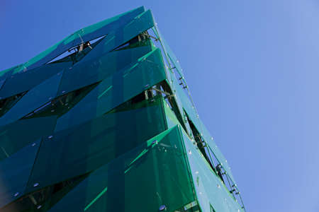 Skelleftea, Norrland Sweden - July 29, 2020: the corner of a green modern parking garageのeditorial素材