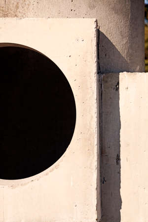 concrete wall with large round hole for a windowの写真素材