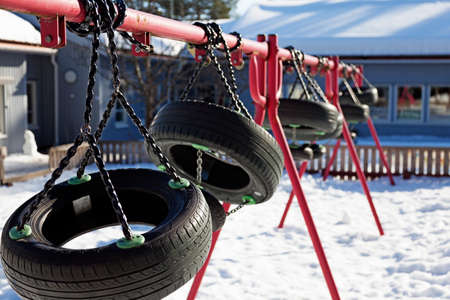 swings suspended for the winterの写真素材