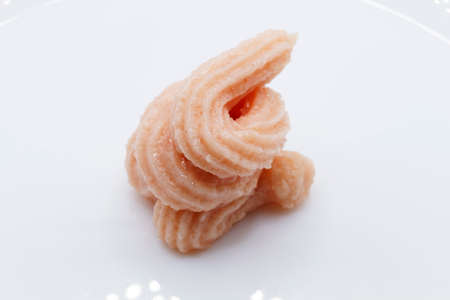 a small clique of caviar on light background