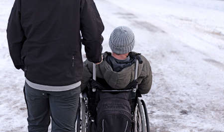 Sundsvall, Norrland Sweden - October 30, 2019: man in wheelchair with companion by his sideのeditorial素材