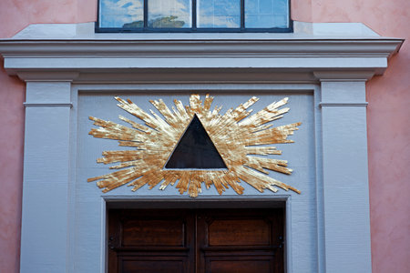 freemason symbol above door on a side street by the castle in Stockholmのeditorial素材