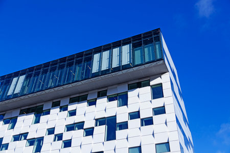 Stockholm, Sweden - October 11, 2022: the corner of a modern house in black white tilesのeditorial素材