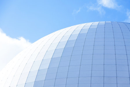 Stockholm, Sweden - October 11, 2022: the Globen arena in bright sunlight and blue skyのeditorial素材