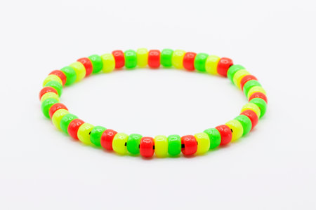 bracelets with plastic beads in red, green and yellowの写真素材