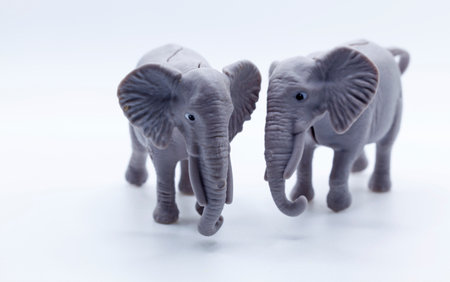 two plastic toy elephants on a white backgroundの写真素材