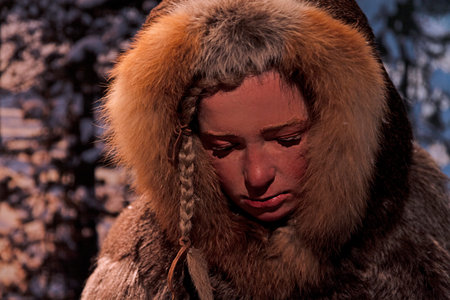 A close-up portrait of a primate with rich brown fur in natural lighting.の写真素材
