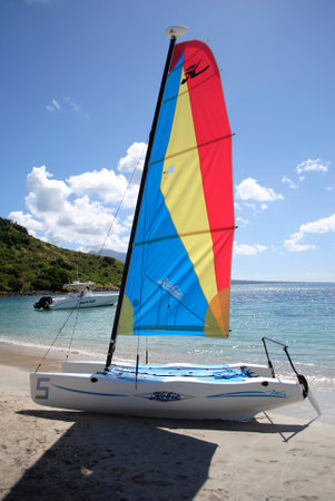 Reggy Beach in St Kitts is one of the Leeward Islands in the Lesser Antilles  JANUARY 19 2012  A catamaran on the silver sand beach for hire to the touristsのeditorial素材