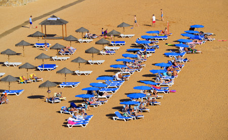 Albufeira, Algarve, Portugal - October 26, 2015 : People enjoying the sun on Albufeira Beachのeditorial素材