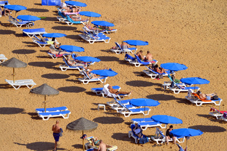 Albufeira, Algarve, Portugal - October 26, 2015 : People enjoying the sun on Albufeira Beachのeditorial素材