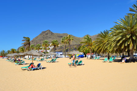 Playa De Las Teresitas beach, Tenerife, Canary Islands, Spain, Europe - June 14, 2016: Tourists on the beach enjoying the sunのeditorial素材