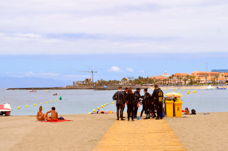 Scuba divers on the beach doing last minutes checks before entering the seaのeditorial素材