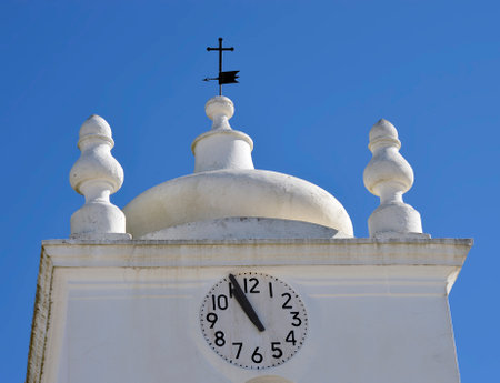 Querenca, Algarve, Portugal - October 6, 2014 : Church of Nossa Senhora da Assuncao clock tower in...