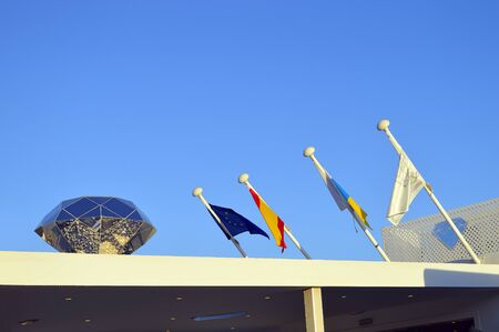 Diamond and flags on the roof of a building