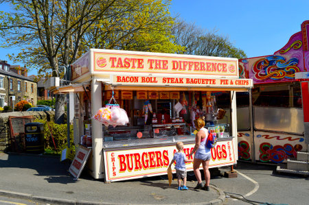 Hollingworth Lake, Littleborough, Rochdale, Greater Manchester; England; UK, Europe  - April 21, 2019 : Burger van at the travelling fairground in Hollingworth Lake Country Parkのeditorial素材