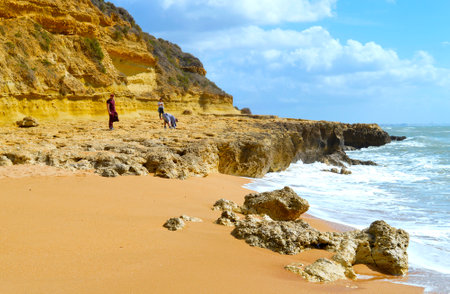 Tourists in the springtime sun on Aveiros Beachのeditorial素材