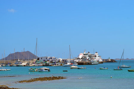 Yachts and ferry in Corralejo harbourのeditorial素材