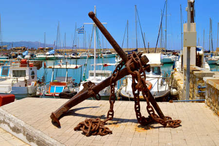 Old rusty anchor and chain in Heraklion port the capital of the Crete one of the Greek islands
