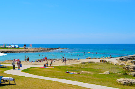 Paphos, Cyprus, Greece - June 5, 2018 : Tourists on Paphos beach a popular tourist resort in Cyprusのeditorial素材