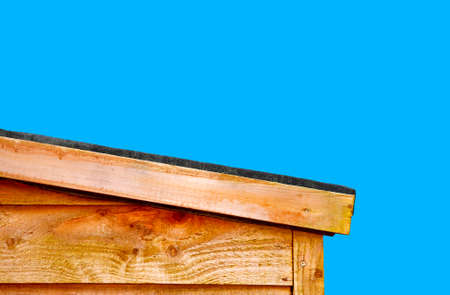A slopping wooden shed roof to let the rain water run off the roof, roofing felt is use to prevent...