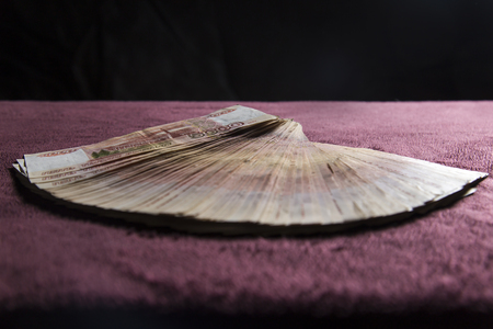 Heap of five thousand russian rubles banknotes, stack on red velvetの写真素材