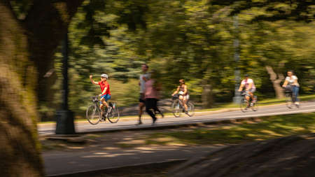 Man taking a selfie on a bicycle in Central Parkの写真素材
