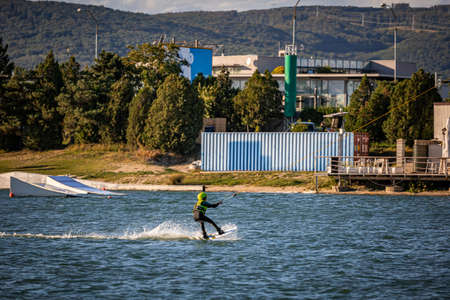 Young boy wakeboarding on a lakeの写真素材
