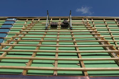 roofing work on a house on Lucerne Switzerland. With green colorの写真素材