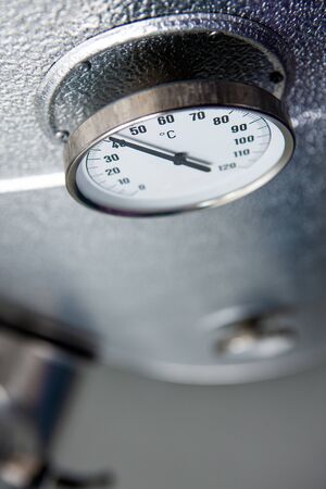 Pipes and gauge in heating and cooling space. With copy space out of focusの写真素材