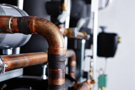 Technology background - industry, valves, tech, pipes and gears. brown and golden colorの写真素材