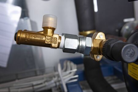 valve at the end of a water end with various connectors. With gold colorの写真素材