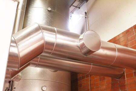 chrome pipes in heating and AC rooms in buildings of factories and hospital. With chrome colorの写真素材