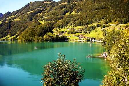 lake lungern Switzerland - famous fishing lake in Switzerland.Reflection in waterの写真素材