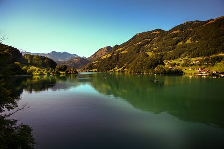 lake lungern Switzerland - famous fishing lake in Switzerland.Reflection in waterの写真素材