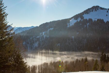 above the fog in Lungern with the swiss Alps, shot above the cloudsの写真素材