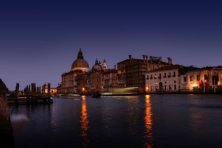 Romantic Sunset in Venice, Italy, Europe with reflection in the seaの写真素材