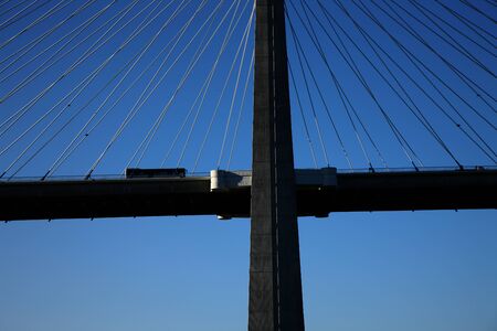 Big bridge in Lisbon, Portugal. Trucks crossing the bridgeの写真素材