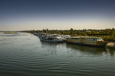 tourist boat on nile river in Luxor - egypt, showing the Nile riverの写真素材