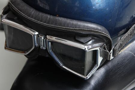 Old biker helmet and goggles. with break pedalの写真素材