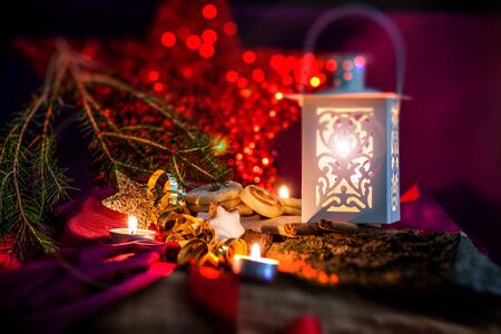 Christmas concept with red background and candles with copy spaceの写真素材