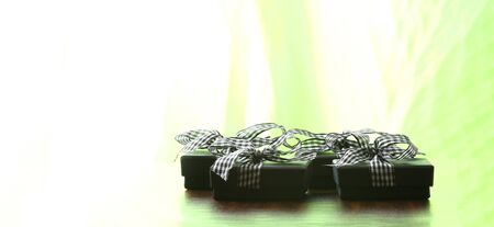 brown christmas present with ribbon. Presents in a table with decoration and copy space and a ribbon