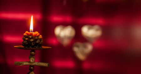 Christmas concept with red background and candles with copy spaceの写真素材