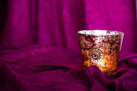 Red christmas background with candles and copy space. Purple color