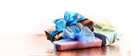 christmas presents with copy space with a ribbon bow on a table