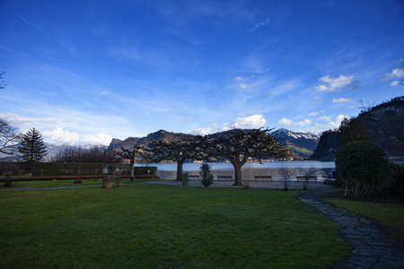 lake lucerne with Rig with clue sky and clouds with treesの写真素材