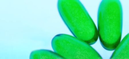 covid-19 virus and green pills for a possible cureの写真素材