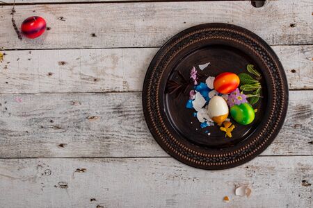 colored easter egg on wood background with copy spaceの写真素材