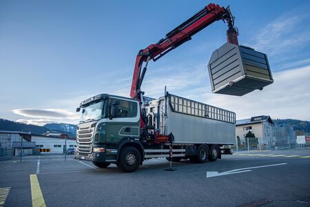 truck with crane emtying recycle. Green planetの写真素材