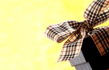 brown christmas present with ribbon. Presents in a table with decoration and copy space and a ribbonの写真素材