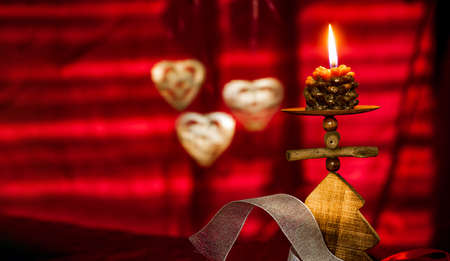 Red Christmas background with candleの写真素材
